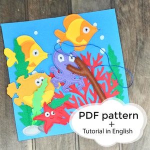 Puede incluir: Un kit de manualidades de fieltro que representa una escena submarina colorida con peces, un pulpo, corales y una caña de pescar. El kit incluye un patrón PDF y un tutorial en inglés.