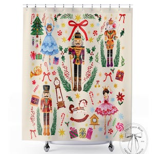 May include: A cream-colored shower curtain featuring a whimsical Nutcracker theme. The design includes illustrations of nutcrackers, ballerinas, Christmas trees, and holiday ornaments. The Coco Bear original design logo is in the bottom right corner.