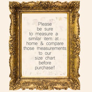 May include: An ornate picture frame in a gold colour with a white background and black text that reads: "Please be sure to measure a similar item at home & compare those measurements to our size chart before purchase!"