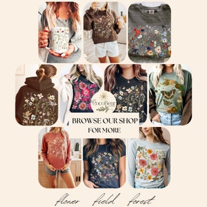 May include: A selection of clothing items, including a mug, sweatshirts, hoodies, and t-shirts, all adorned with floral patterns. The image includes the text "Browse our shop for more" and the words "Flower field forest". The items are in various colors.