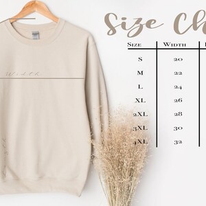 May include: Size chart for a beige sweatshirt with measurements in inches for width, length, and sleeve length. Sizes range from S to 4XL.