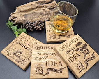 May include: Four wooden coasters with different designs featuring the word "Whiskey" and the phrase "Time to drink". The coasters are made of light brown wood and have a rustic look. One coaster features a skull with a cowboy hat, another features a glass of whiskey with ice, and another features a barrel of whiskey.