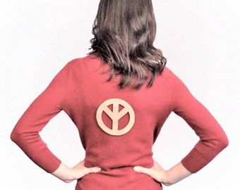 Photo of Model in Sweater with Peace Sign Patch on Back