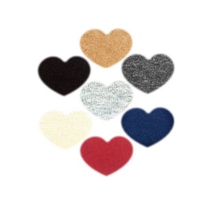 May include: Seven heart-shaped fabric swatches in different colors: beige, black, light gray, white, navy blue, and red.