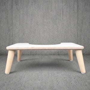 Original white wooden toilet stool. A stylish and practical addition to your bathroom routine, perfect for a happy ending or as a gift idea.