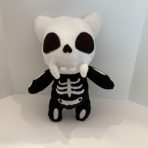 Spooky skeleton cat plush