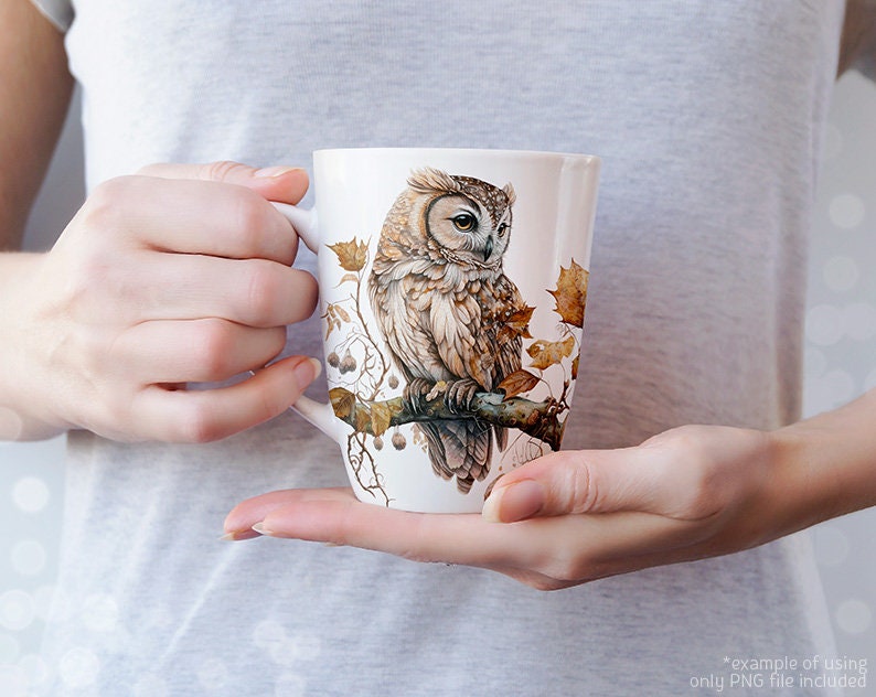 May include: A white ceramic mug with a brown and white owl illustration. The owl is perched on a branch with leaves and berries. The mug is a great gift for nature lovers.