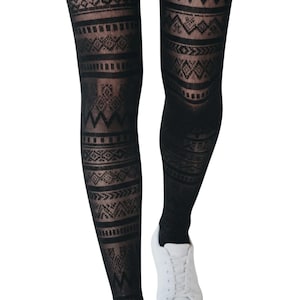 May include: Black sheer tights featuring a repeating horizontal pattern of geometric shapes, diamonds, and zig-zag lines. The hosiery is paired with a plain white trainer, showcasing the intricate knit design against the dark fabric texture.