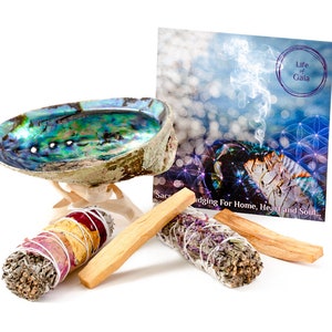 May include: A smudging kit with a abalone shell, sage smudge sticks, palo santo sticks, and a card that says "Life of Gaia Smudging For Home, Heart and Soul..."