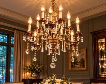 May include: A multi-tiered bronze chandelier featuring twelve candle-style lights with white sleeves. The fixture is adorned with numerous clear glass crystal droplets and faceted prisms that hang from curved arms, creating a bright illumination.
