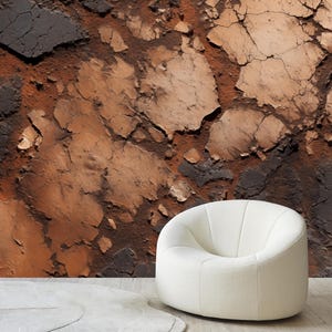 May include: A modern, white, rounded armchair with vertical stitching detail sits in front of a textured wall. The wall features a distressed, abstract design in shades of brown, black, and beige.