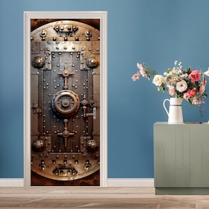 May include: A close-up of a metal door with a large, circular lock in the center. The door is made of thick metal and has a weathered, industrial look. The door is surrounded by a white frame.