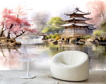May include: A watercolor painting of a traditional Japanese pagoda with a bridge and cherry blossom trees reflected in a still pond. The scene is painted in soft, muted tones of pink, green, and blue.
