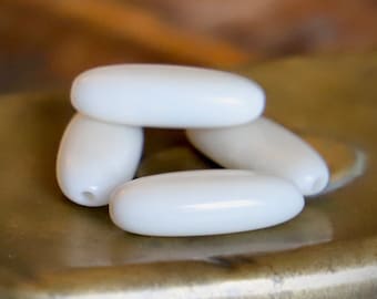 Perles Tagua naturel forme olive /ivoire végétal :20-28 mm/2 pcs-4 pcs
