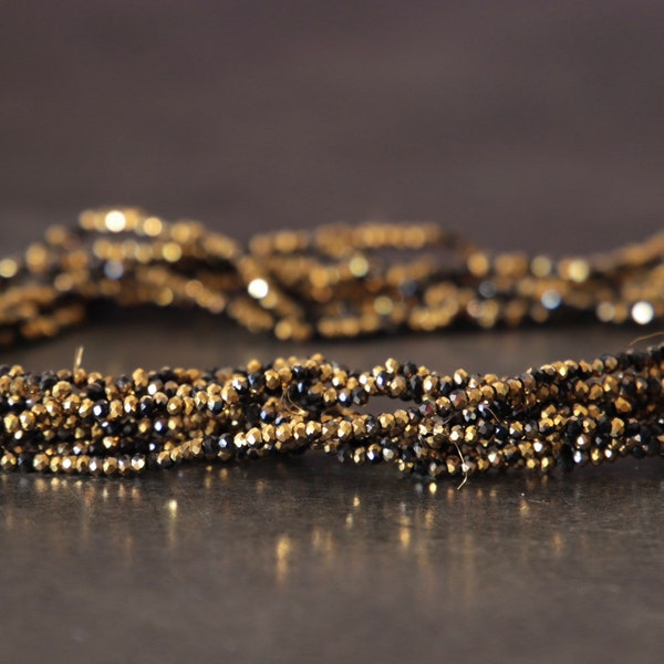 Opaque black and gold faceted glass beads/2x1.5mm/hole 0.4mm/strand 28 cm-about 195 beads