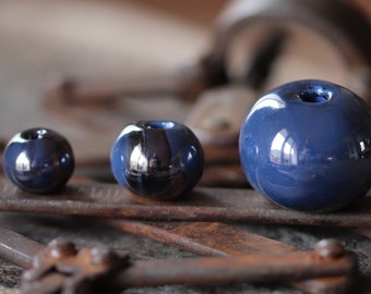 Ceramic beads iridescent blue marbled black round irregular /3 diameters: 12-15-22 mm/2 pcs/ porcelain