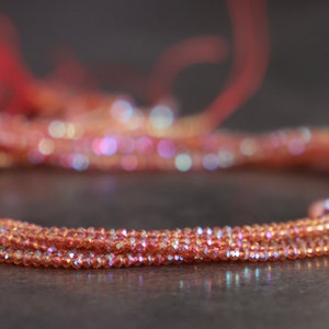 Perle di vetro arancione traslucido iridescente sfaccettato/2x1.5mm/foro 0.6mm/filo 37cm-circa 240 perline