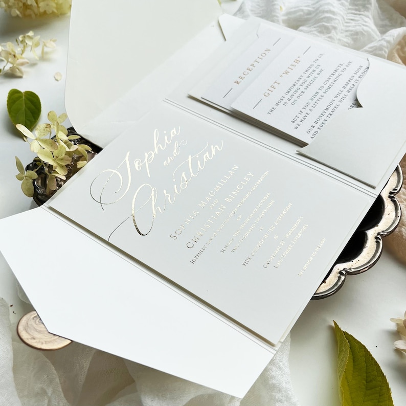 Luxurious wedding invitation made of gold foil in a pocket