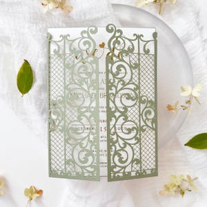 Sage green ornamental gatefold laser cut wedding invitation cover – 5x7 with gold foil insert displayed