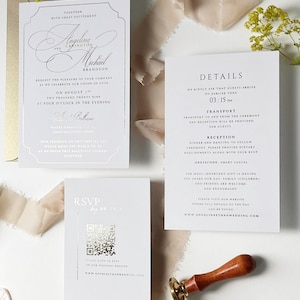 Puede incluir: Un juego de invitaciones de boda blancas que incluye una tarjeta principal, una tarjeta de detalles y una tarjeta RSVP con un c&oacute;digo QR plateado. El texto incluye los nombres Angelina y Michael Brandson, detalles del evento y una URL. Incluye un sello de cera.
