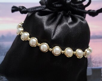 Armband: schakelarmband met parel en gouden kralen