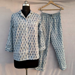 May include: A blue and white floral print pajama set with a long-sleeved shirt and pants.