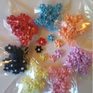 100 Royal icing drop flowers 5/8" mix or match any colors.