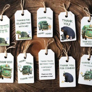 May include: Nine printable favor tags featuring a green cartoon trash truck with a smiling face. The tags have different designs, including the text "Thank You!" and "Honk! Honk!" and a cartoon bear.