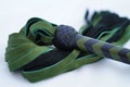 Green Suede Leather Flogger: Thuddy Mop BDSM Toy product logo