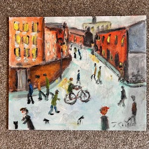 May include: An impressionistic painting of a city street scene. Buildings with orange and yellow facades line the street, with figures of people and a bicycle. The artwork has a textured, painterly style.