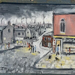 May include: An oil painting depicting a street scene with buildings, figures, and a dark, overcast sky. The buildings are primarily gray and red, with a shop front that reads "Tuck Shop". Figures are walking on the street and sidewalk.