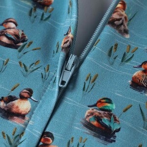 Close up View of Duck Print Long Sleeved Swing Dress in Blue