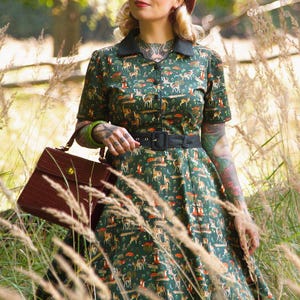 A model wearing a Dark Green Woodland Shirt Dress