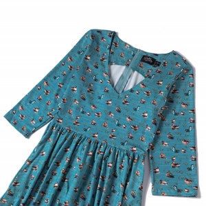 Close up View of Duck Print Long Sleeved Swing Dress in Blue