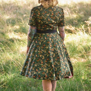 A model wearing a Dark Green Woodland Shirt Dress