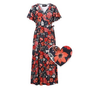 May include: A navy blue wrap dress with a vibrant floral print in shades of red, white, and orange. The dress has short, flutter sleeves and a V-neck. A heart-shaped detail highlights the floral fabric's close-up.