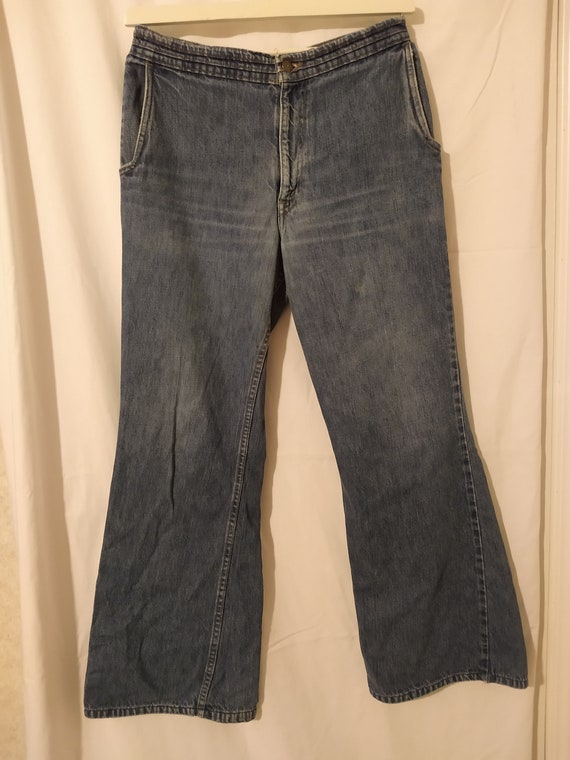 Vintage 1970s Levi's orange feather tab Jeans