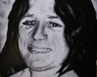 May include: Black and white pencil drawing of a person with long dark hair. The person is looking down and has a serious expression on their face. The drawing is signed "Oslaigh na hÉireann Bobby Sands M.P."
