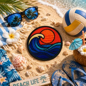 May include: A circular embroidered patch featuring a stylized orange sun setting over dark blue ocean waves with a yellow crest. The patch is surrounded by beach items including sunglasses, a volleyball, seashells, and a tropical drink.