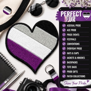 May include: A heart-shaped embroidered patch featuring horizontal stripes of black, gray, white, and purple. The patch is displayed alongside a black camera, a pen, sunglasses, and a black sign with white text listing various uses for the patch.