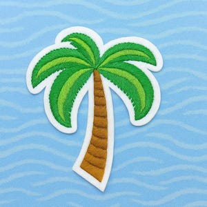 May include: Embroidered palm tree patch with green fronds and a brown trunk, outlined in white. The patch is set against a light blue background with wavy lines, evoking a tropical theme.