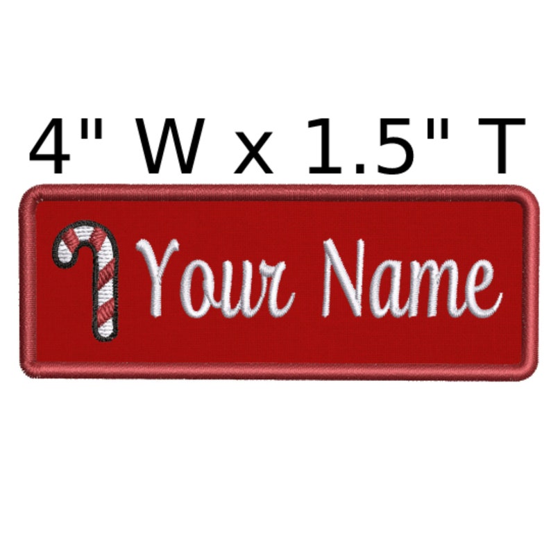 May include: Red rectangular iron-on patch with a white candy cane and the text "Your Name" in white cursive font. The patch measures 4 inches wide by 1.5 inches tall.