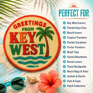 May include: A round embroidered patch featuring the text Greetings From Key West in red and green, a green palm tree, and blue waves on a beige background. The patch has a red border and is displayed alongside a map, sunglasses, and a flower.