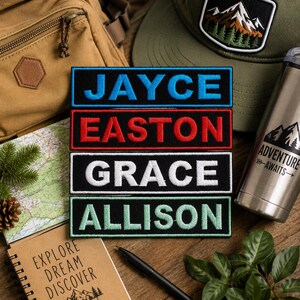 May include: Four rectangular embroidered patches with black borders, each featuring a name in capital letters: JAYCE in blue, EASTON in red, GRACE in white, and ALLISON in light green. The patches are arranged vertically in a stack.