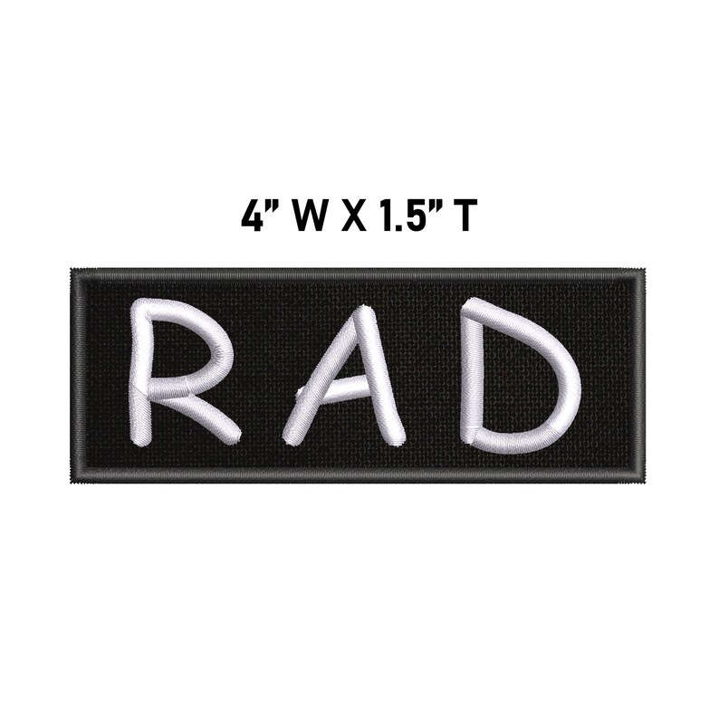 May include: A rectangular embroidered patch with a black background and the white text RAD in a sans-serif font. The patch features a black border and measures 10.16 cm wide by 3.81 cm tall as indicated by the text above the item.
