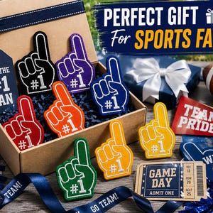 May include: A cardboard gift box containing multiple foam finger patches in various colors including black, purple, blue, red, orange, green, and yellow, each featuring a white number one. Includes a navy tag reading FOR THE #1 FAN and a ticket reading GAME DAY.