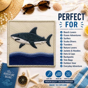 May include: A square embroidered patch featuring a dark blue shark swimming above dark blue waves on a beige background. The text reads PERFECT FOR, followed by a list of uses, and SEW-ON, IRON-ON, HOOK & LOOP, PREMIUM QUALITY, DETAILED EMBROIDERY.