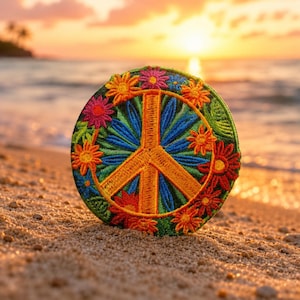 May include: A circular embroidered patch featuring a central orange peace sign symbol surrounded by a vibrant array of multi-colored flowers including pink, yellow, red, and blue petals set against a deep green leafy background.