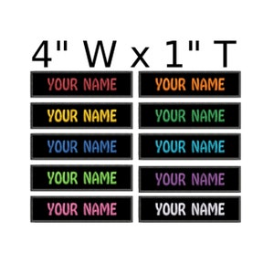 May include: Ten black iron-on name tags with white stitching. The name tags are 4 inches wide and 1 inch tall. The text "YOUR NAME" is embroidered in different colors on each tag.