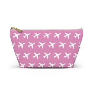 Neceser rosa con aviones, kit de viaje